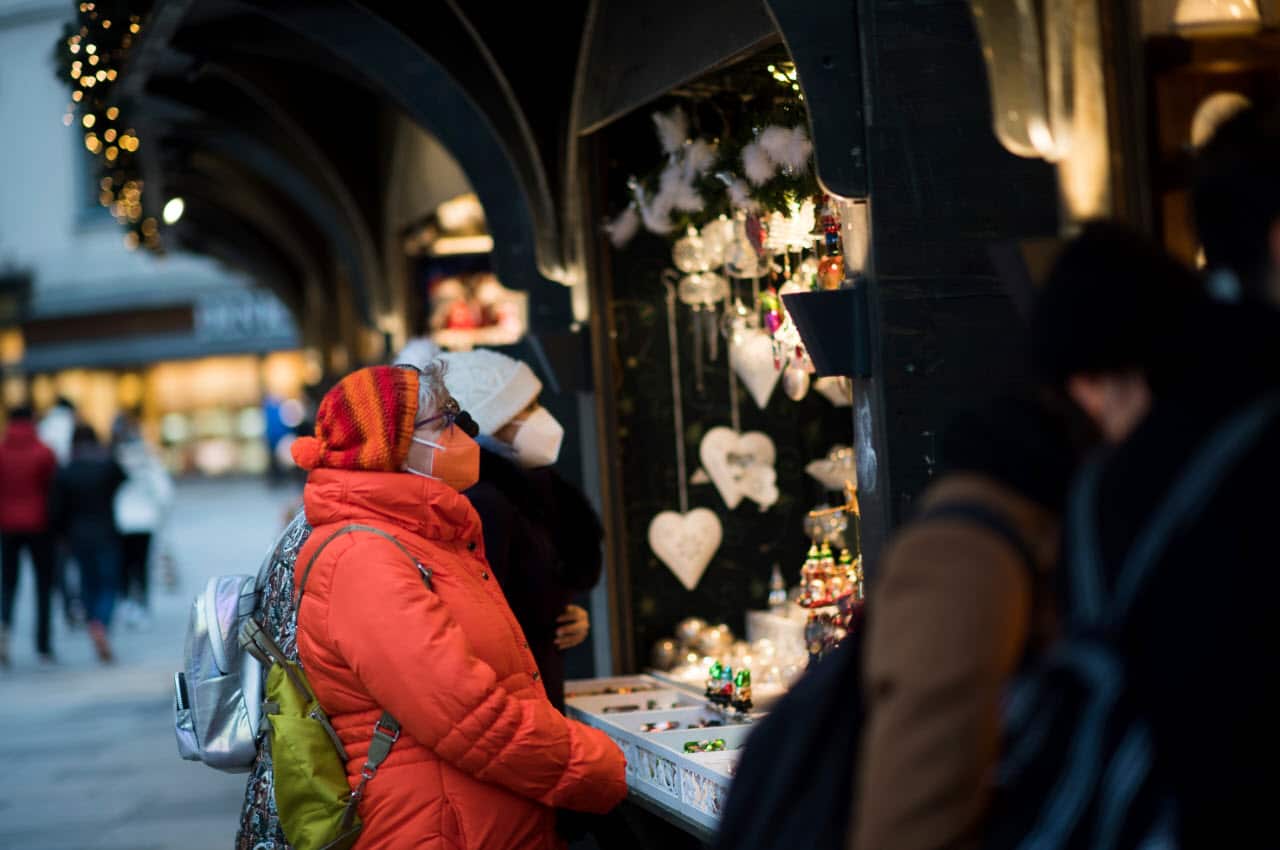 People wearing face mask as they visit a Christmas market in Vienna, Austria, Wednesday, 17 November 2021.
