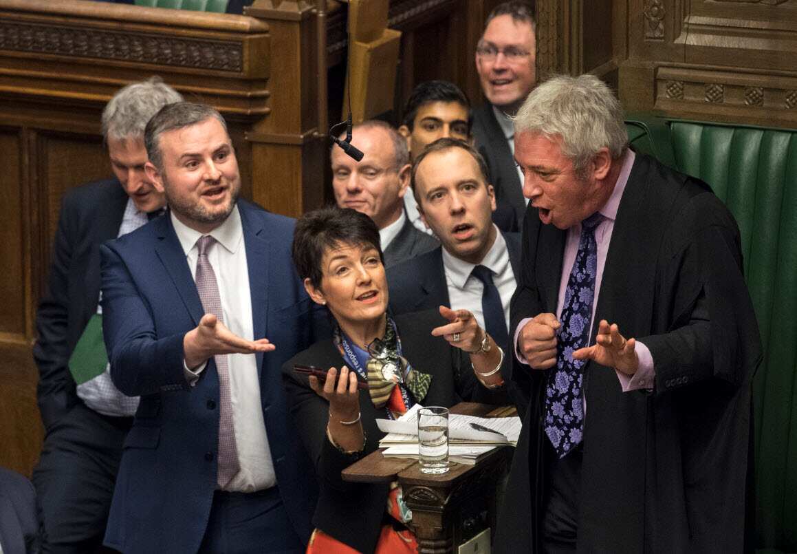 Members of Parliament gather near the Commons Speaker John Bercow urging him to review a video clip of Jeremy Corbyn