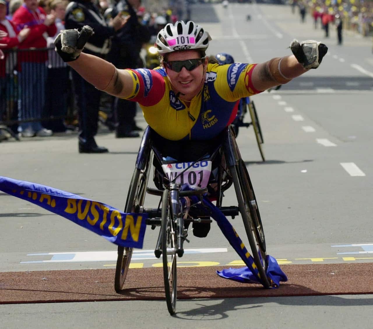Louise Sauvage of Australia reacts as she crosses the finish line in Boston to win the women's wheelchair division of the 105th Boston Marathon Monday, April 16, 2001. (AP Photo/Elise Amendola)