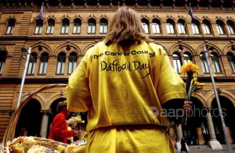 Volunteers selling daffodils as part of the annual daffodil day fundraising event.