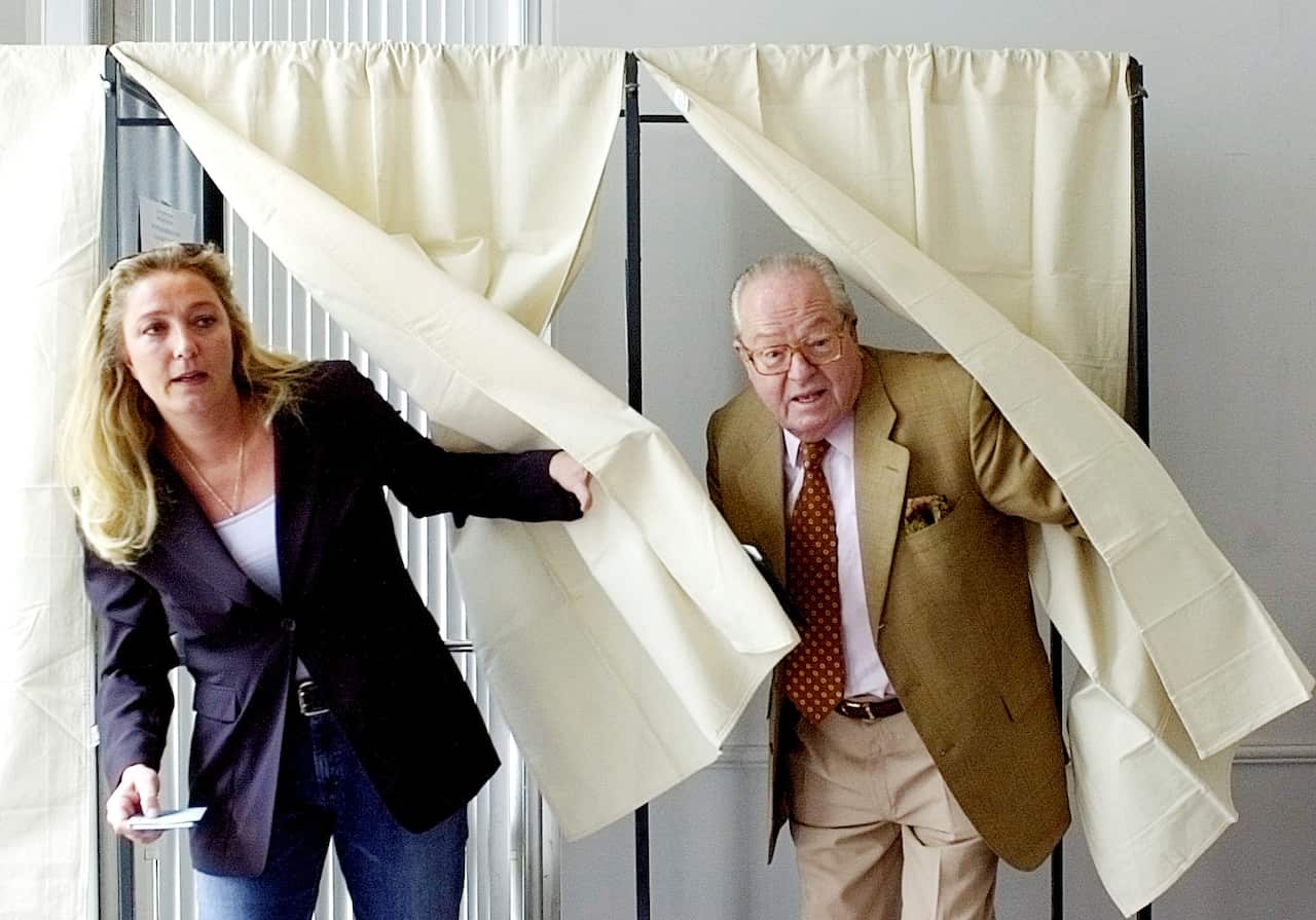 French far right National Front party leader Jean-Marie Le Pen and his daughter Marine in 2004.