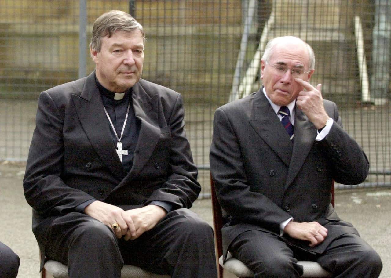 George Pell (left) with former Prime Minister John Howard in a photo from 2004. 