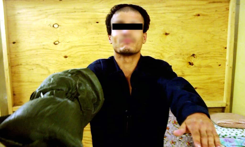 A photo released by SBS' Dateline on 15 February, 2006 allegedly shows a psychologically disturbed prisoner in Iraq's notorious Abu Ghraib jail being retrained by padding his right arm in Baghdad in 2004.