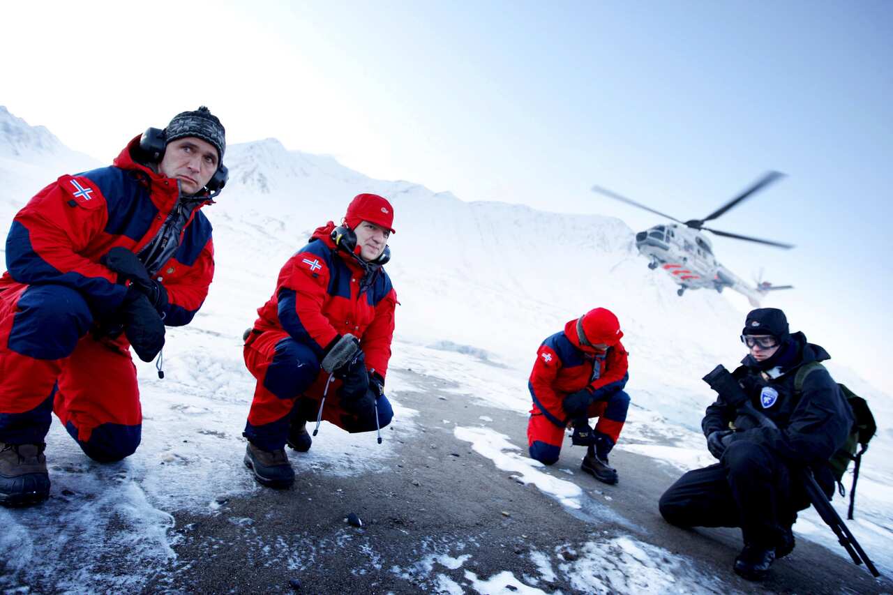 European Commission president Jose Manuel Barroso (2-L) and Norwegian prime minister Jens Stoltenberg (L) on a glacier in Svalbard in 2008.