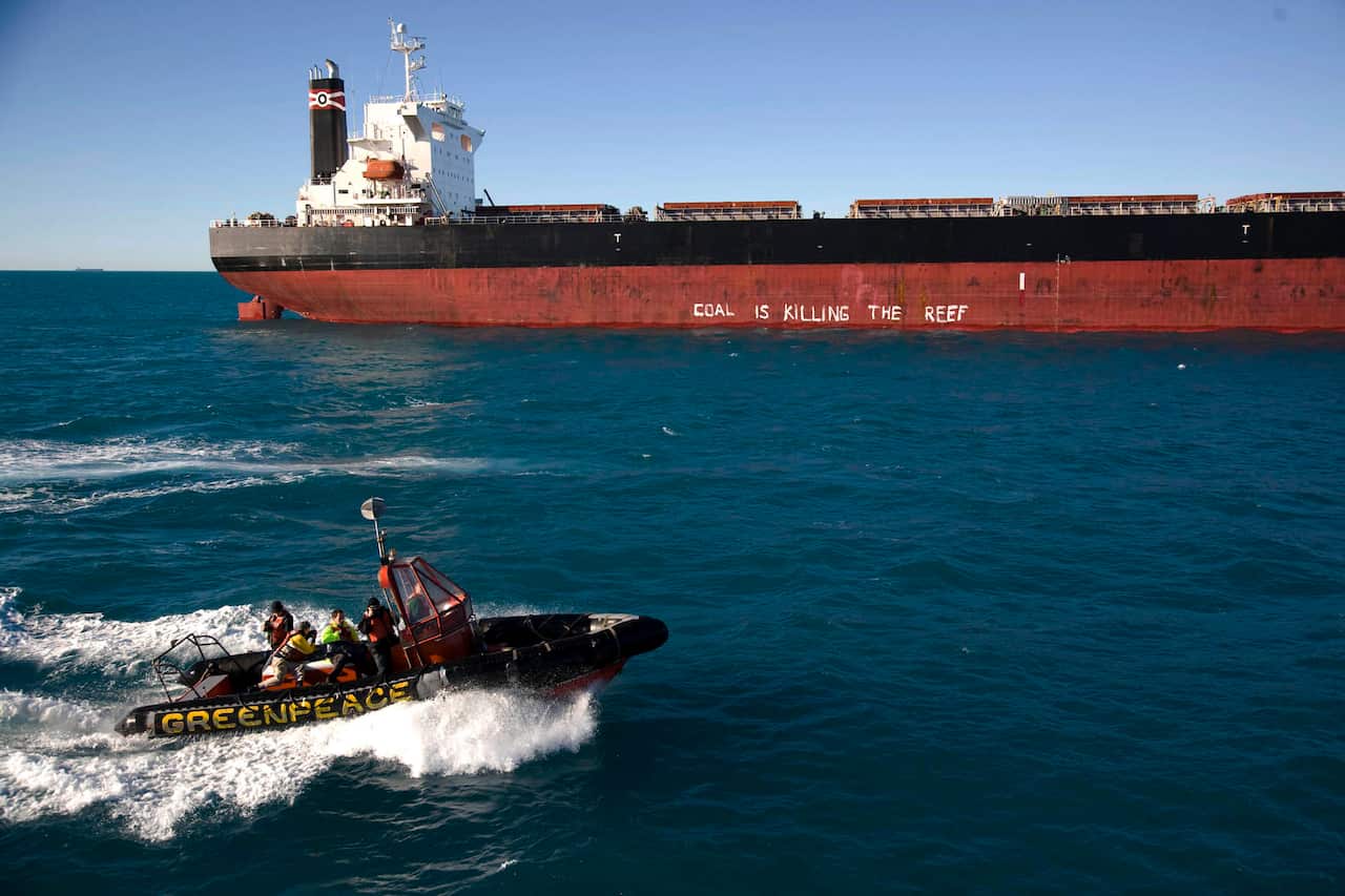 A coal ship with protest slogans painted on at Hay Point Port.