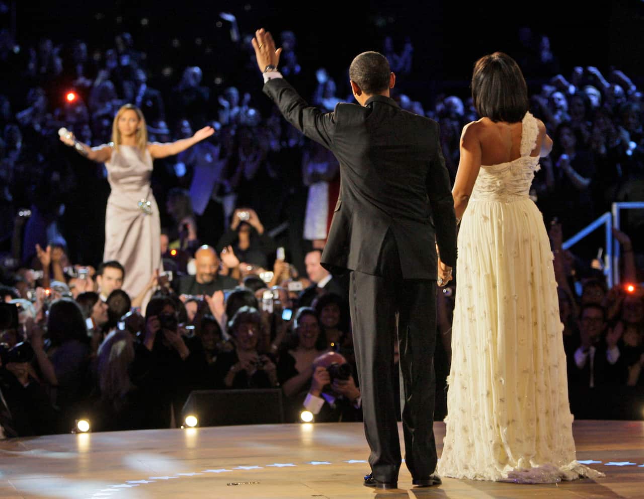 Barack and Michelle Obama wave to singer Beyonce after their first dance together at the Inaugural Ball.