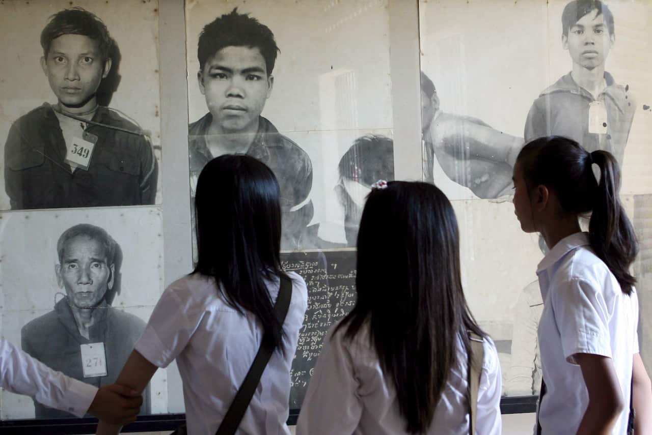 A file photo of Cambodian students viewing photographs of Khmer Rouge victims on display at Tuol Sleng Genorcide Museum (S-21 prison), in Phnom Penh, Cambodia.
