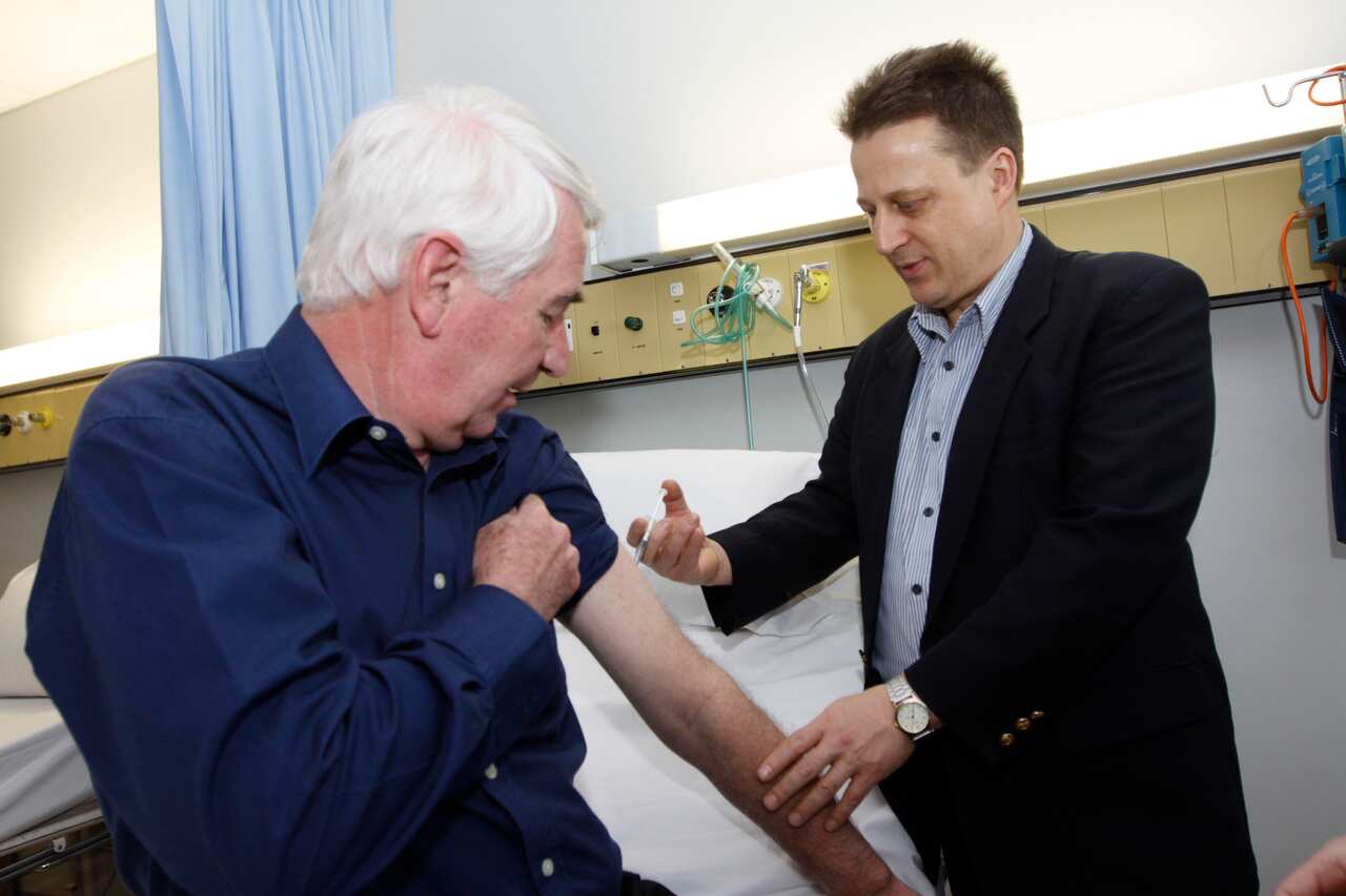 Professor Nikolai Petrovsky is pictured administering a swine flu vaccine in 2009.