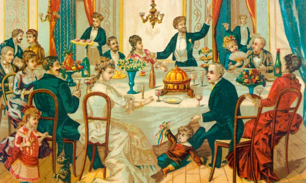 A big English family party: a guest proposes a toast, children play and servants bring more food, circa 1880.