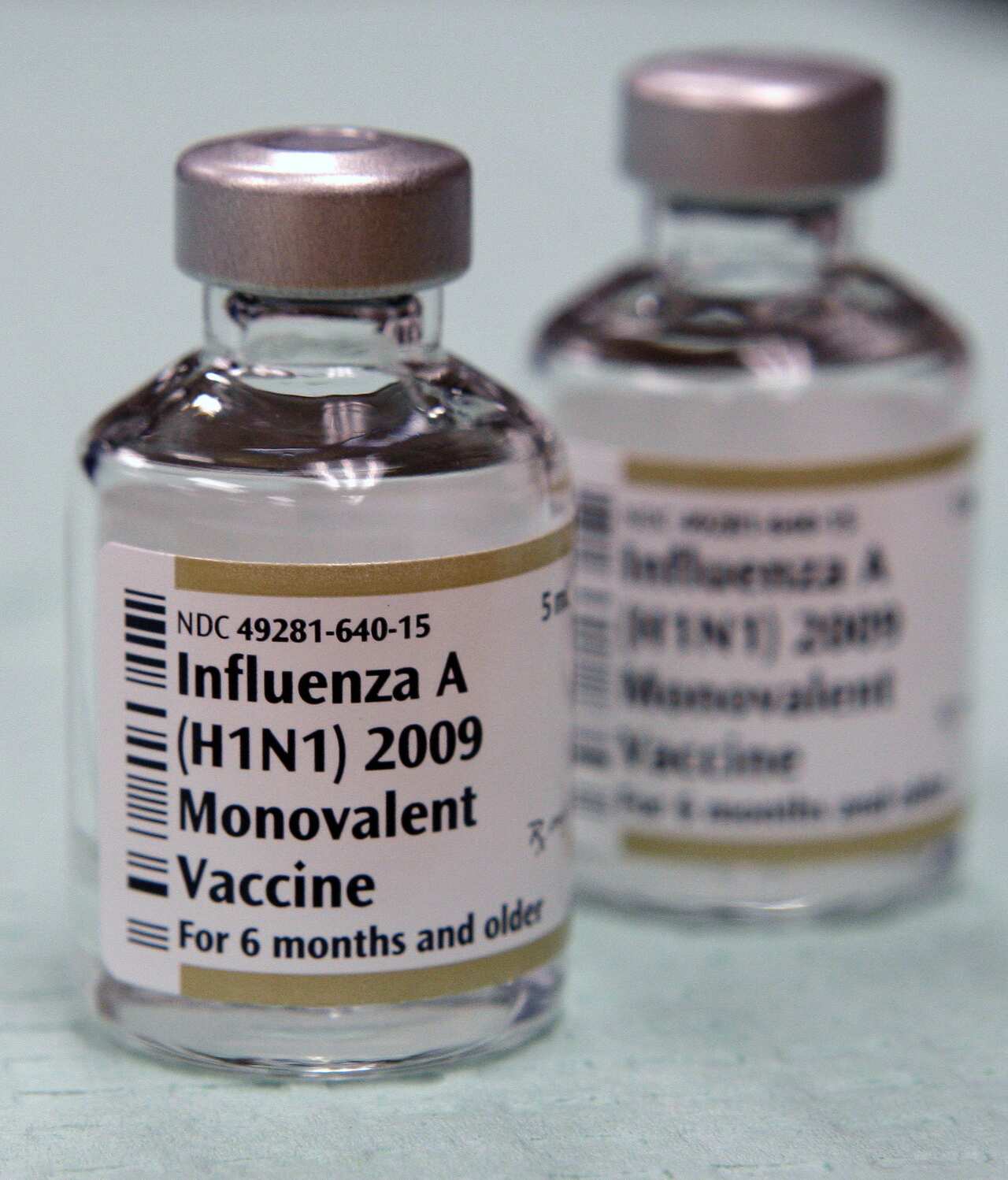 Ampoules of swine flu (H1N1) vaccine are seen during a clinic for first responders at the Winchester Town Hall, Tuesday, Nov. 10, 2009. (AP Photo/Charles Krupa)