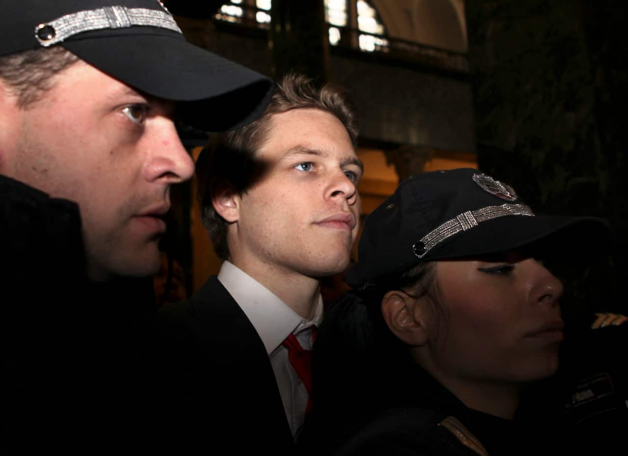 Bulgarian police officers escort Australian citizen Paul "Jock" Palfreeman, center, as he arrives for his trial at Sofia City Court in the Bulgarian capital.