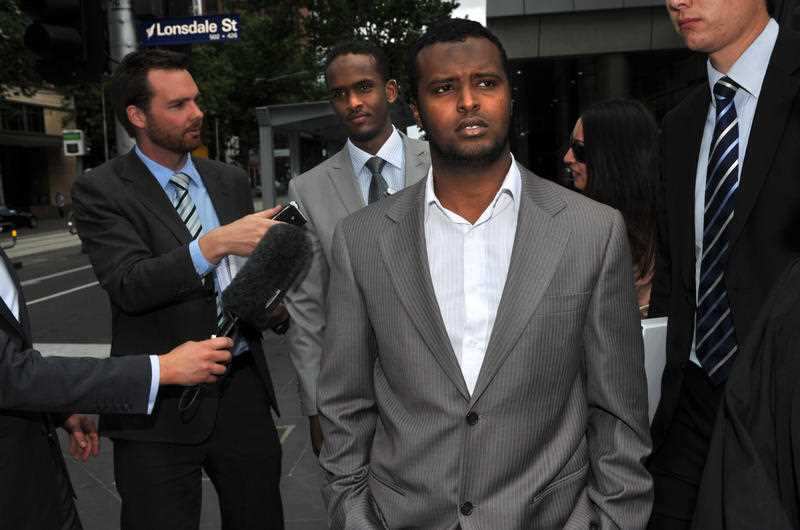 Yacqub Khayre (right) and Abdirahman Amend leave court in Melbourne, Thursday, Dec. 23, 2010. 