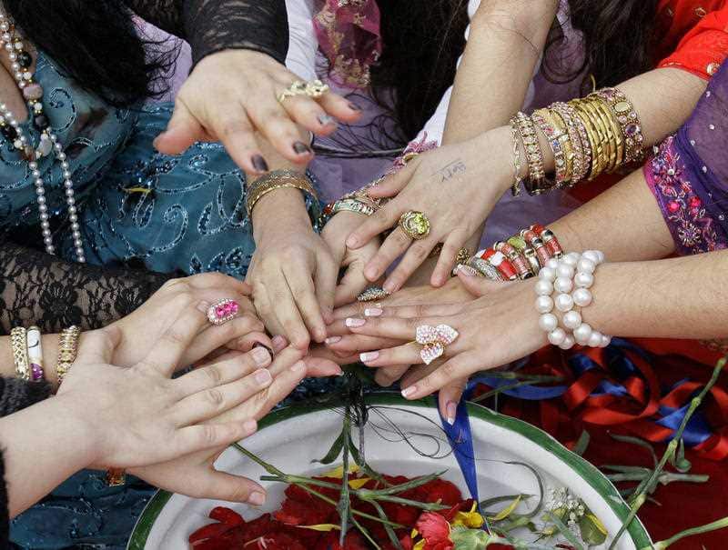 The hands of Romanian witches, during a Valentine's Day ritual in Mogosoaia, Romania, Monday, Feb. 14, 2011.