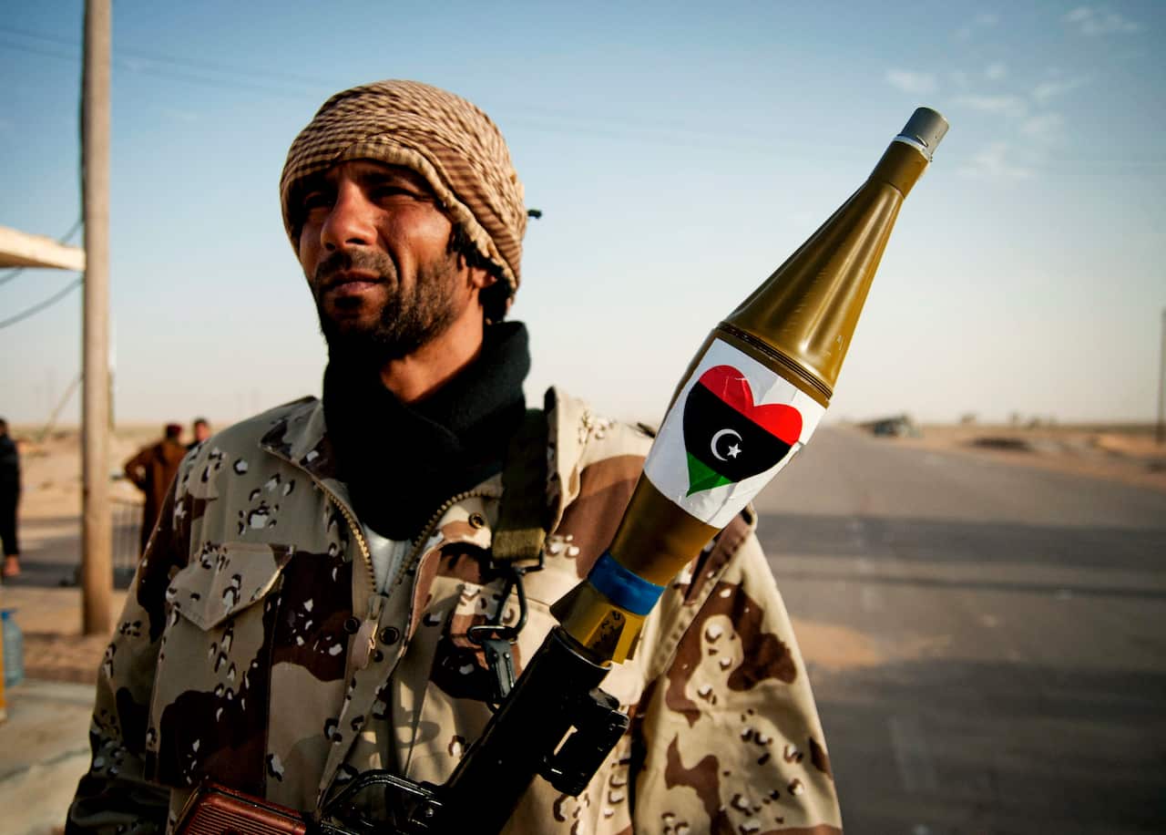 A Libyan rebel soldier holds a RPG launcher at a road check point, near the city of Ajdabiya, Eastern Lybia.