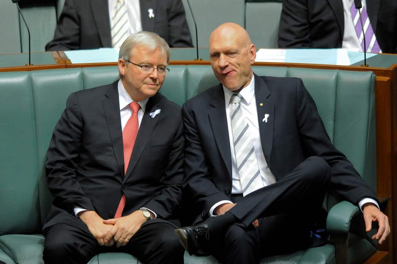 Foreign Minister Kevin Rudd (left) speaks to Minister for Education Peter Garrett during House of Representatives question time at Parliament House Canberra, Thursday, Nov. 24, 2011. (AAP Image/Lukas Coch) NO ARCHIVING