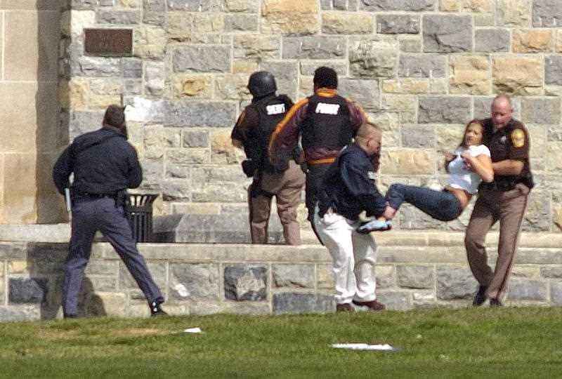 Injured occupants are carried out of Norris Hall at Virginia Tech in Blacksburg, Virginia 