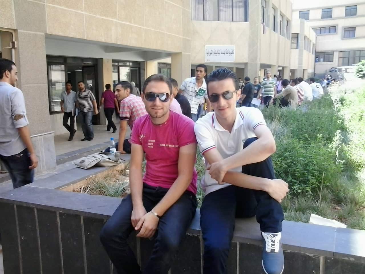 Omar Al-Kassab (R) poses with a software engineering classmate (L) who was later tortured to death.