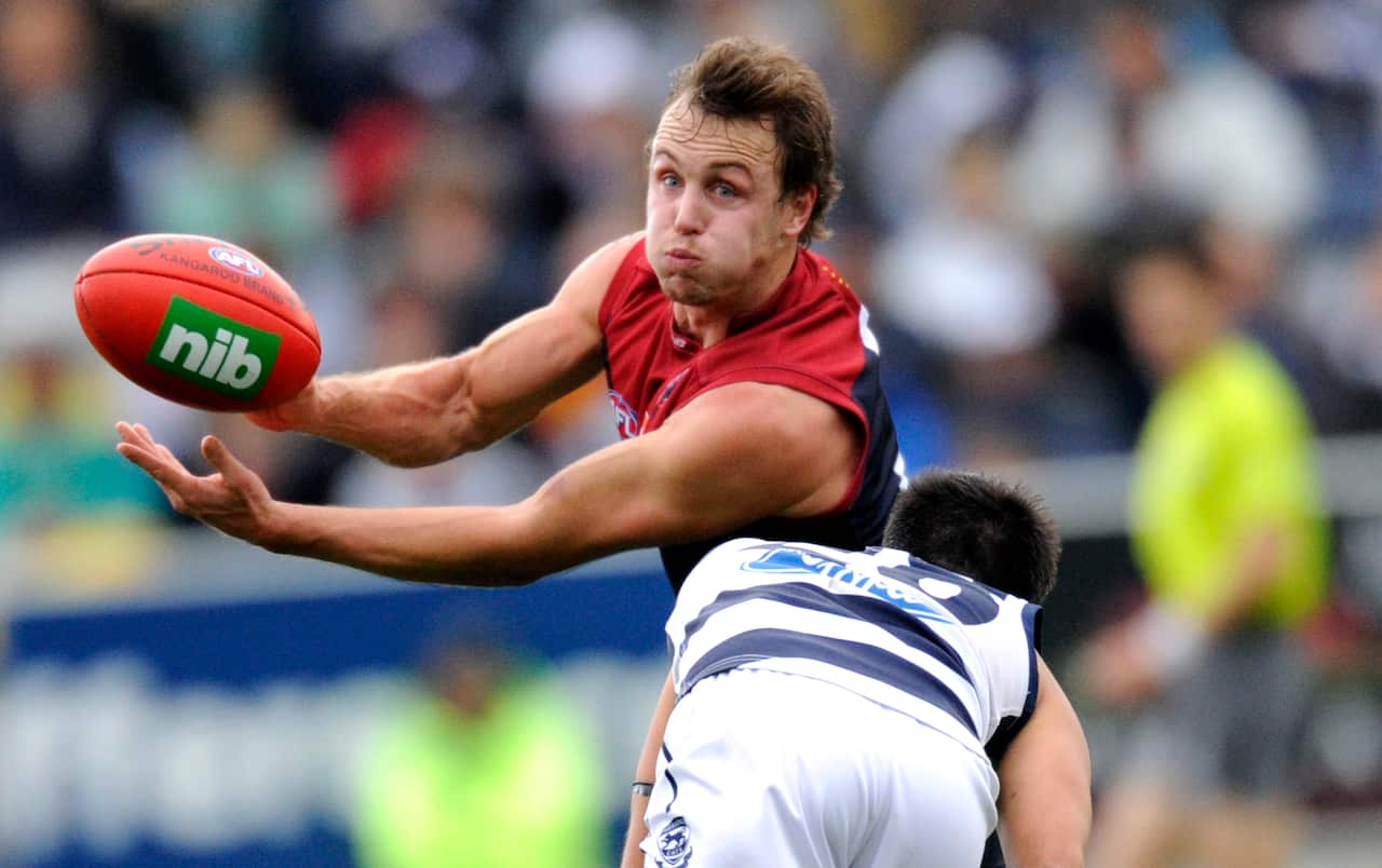 Clint Bartram of the Melbourne Demons in action against the Geelong Cats in 2012. (AAP Image/Julian Smith)