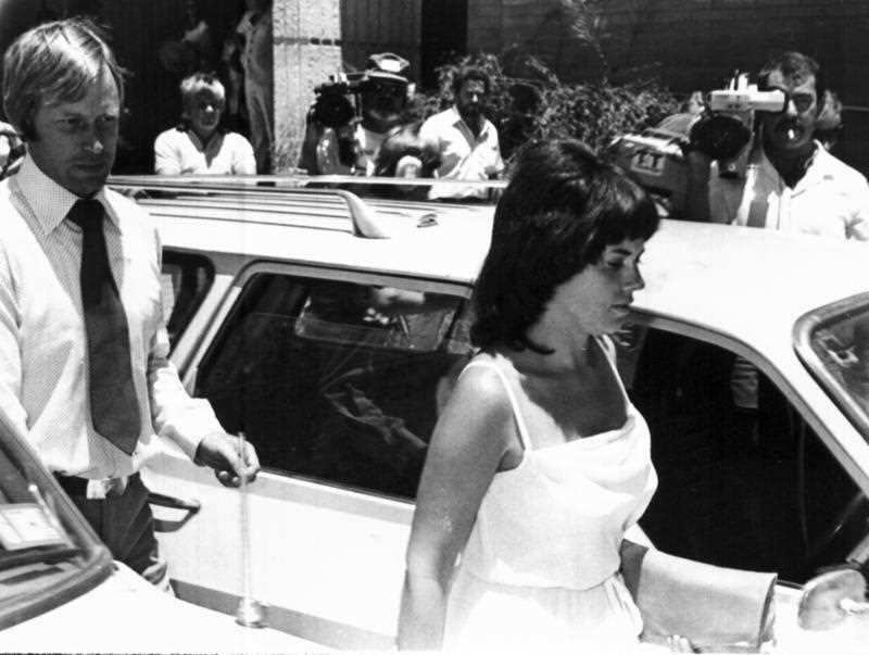 In this Feb. 2, 1982, file photo, Michael, left, and Lindy Chamberlain leave a courthouse in Alice Springs, Australia. 