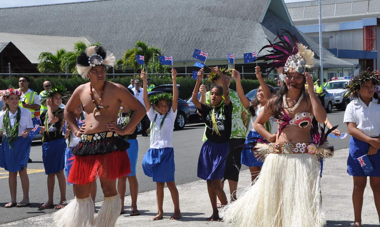 The welcome party for at Rarotonga's airport ahead of a Pacific Islands Forum in the Cook Islands.