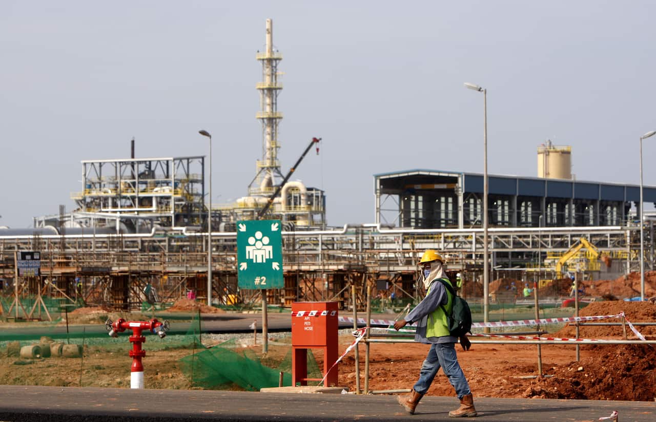 A worker walks at the site of the under construction Lynas rare earths plant in Malaysia. 