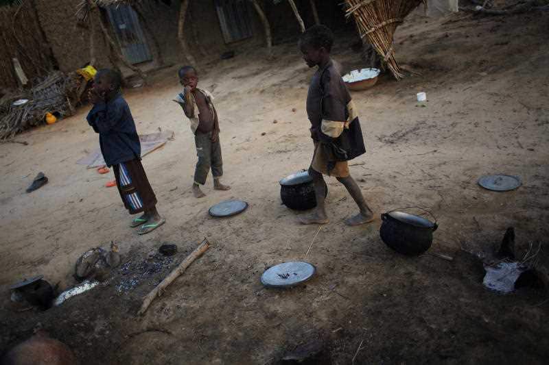 Children walk in a courtyard in the remote village of Hawkantaki, Niger