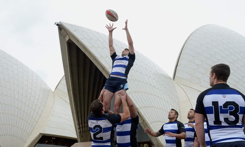 The Sydney Convicts gay rugby club pose with the Bigham Cup in front of the Sydney Opera House in Sydney, Thursday, Oct. 11, 2012. Sydney has been announced as the host the Bingham Cup 2014, the World Cup of gay rugby. (AAP)