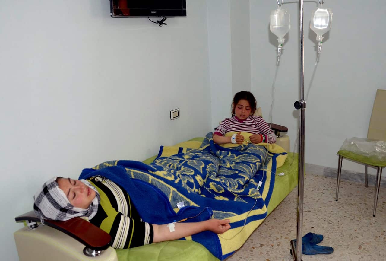 People are treated in a hospital following an alleged chemical weapon attack in Aleppo (AP)