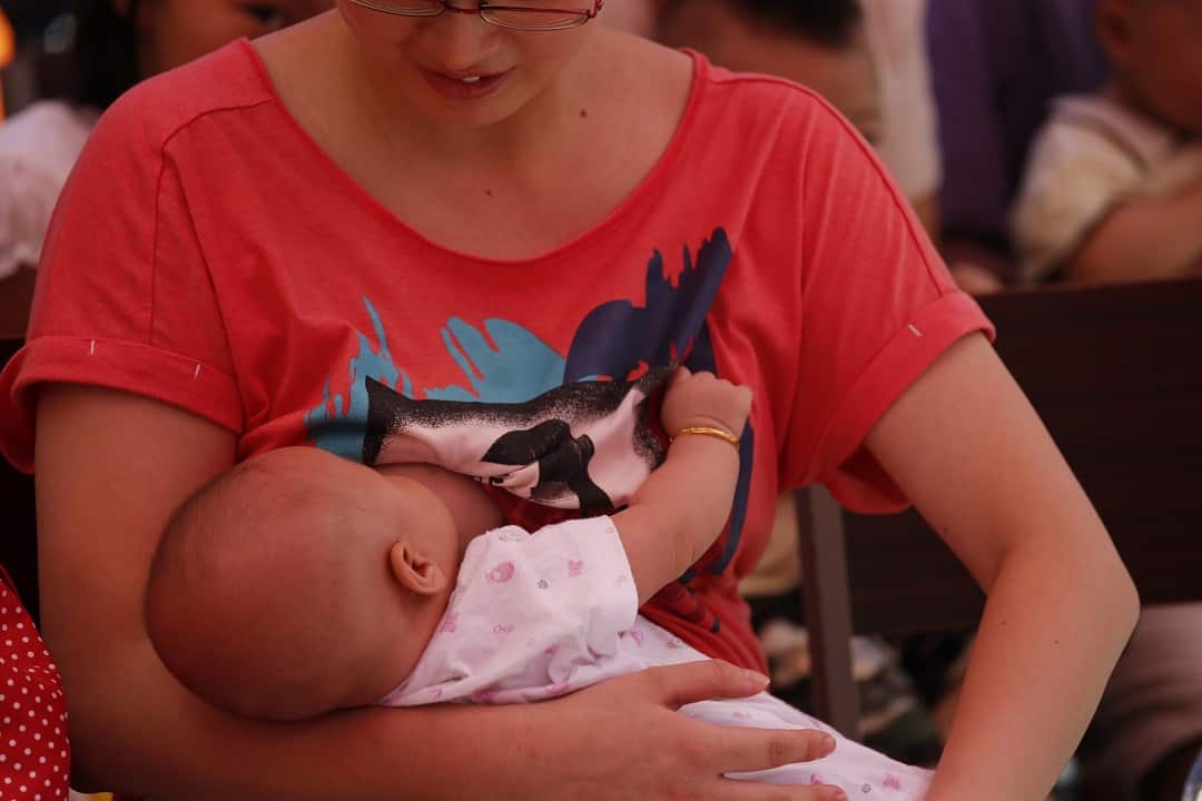 A Chinese mother breastfeeds her baby in Wuhan.