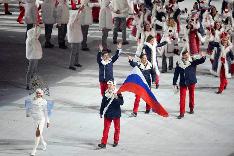 The Russian Federation team enters the stadium for the opening ceremony for the Sochi Winter Olympics.