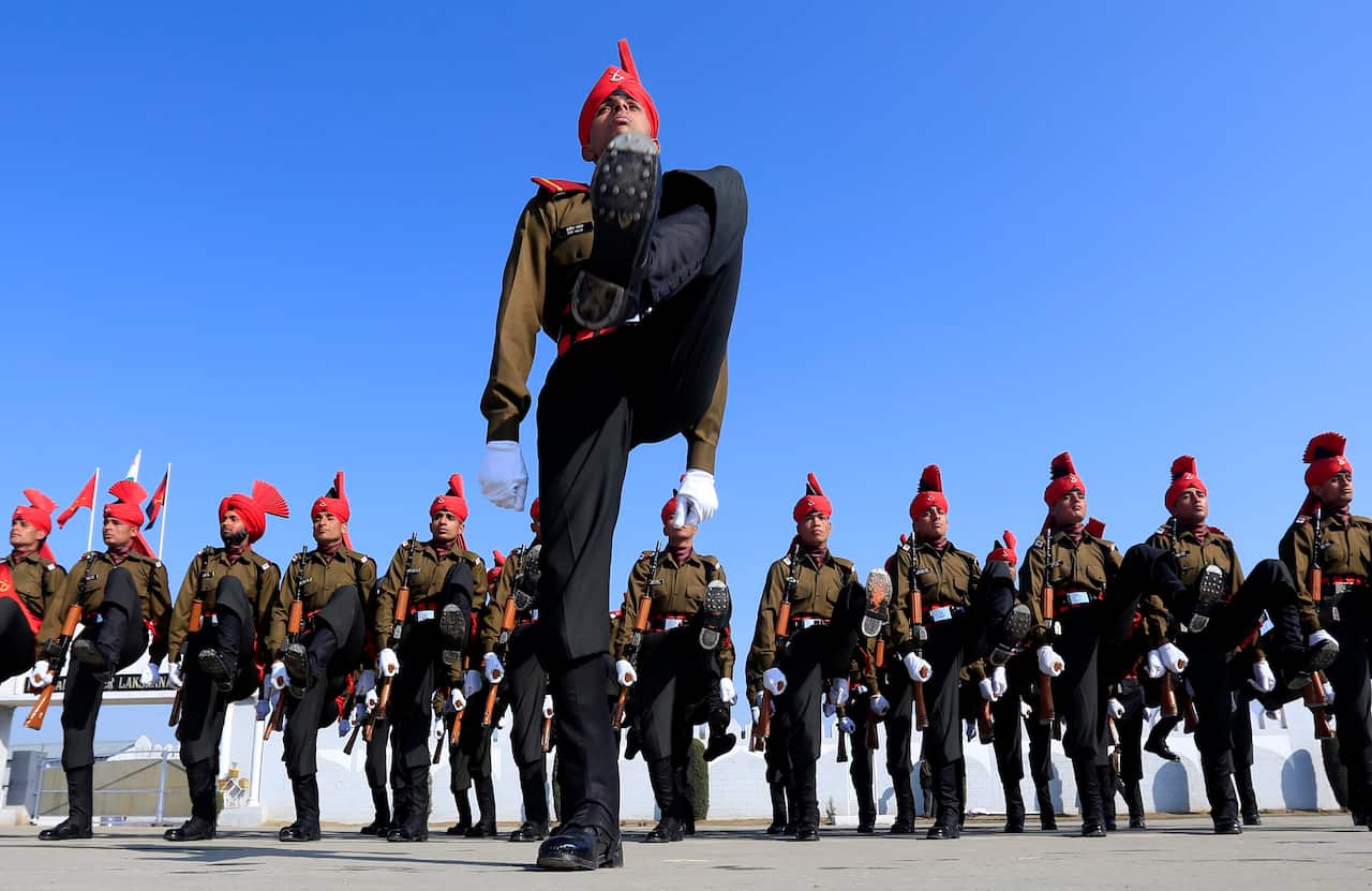 Newly graduated soldiers of the Jammu and Kashmir Light Infantry march during their commencement parade at a military base on the outskirts of Srinagar, India, Saturday, March 8, 2014.