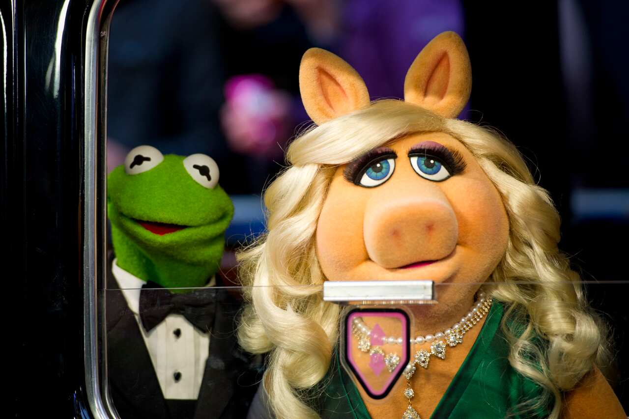 Miss Piggy and Kermit the Frog arriving at the premiere of Muppets Most Wanted, at the Curzon Cinema in Mayfair, London. (AAP)
