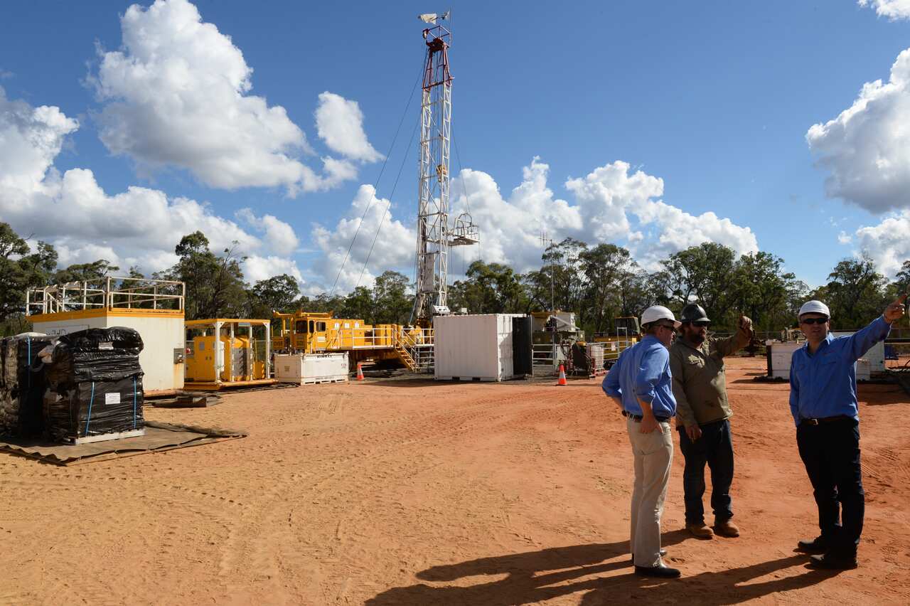 Santos staff at a coal seam gas (CSG) well rig in the Pilliga forest which is part of Santos's Narrabri Gas Project, Narrabri, Friday, May 23, 2014. (AAP Image/Dean Lewins) NO ARCHIVING