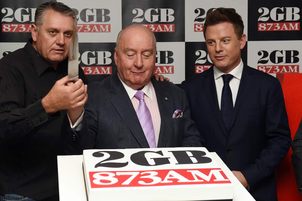 (L to R) 2GB radio hosts, Ray Hadley, Alan Jones and Ben Fordham cut a cake to celebrate 2GB's 10 straight years  on 3 June, 2014. 