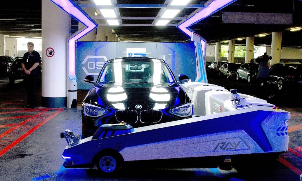 Parking robot 'Ray' transports a car in Duesseldorf, Germany, 23 June 2014. (EPA)