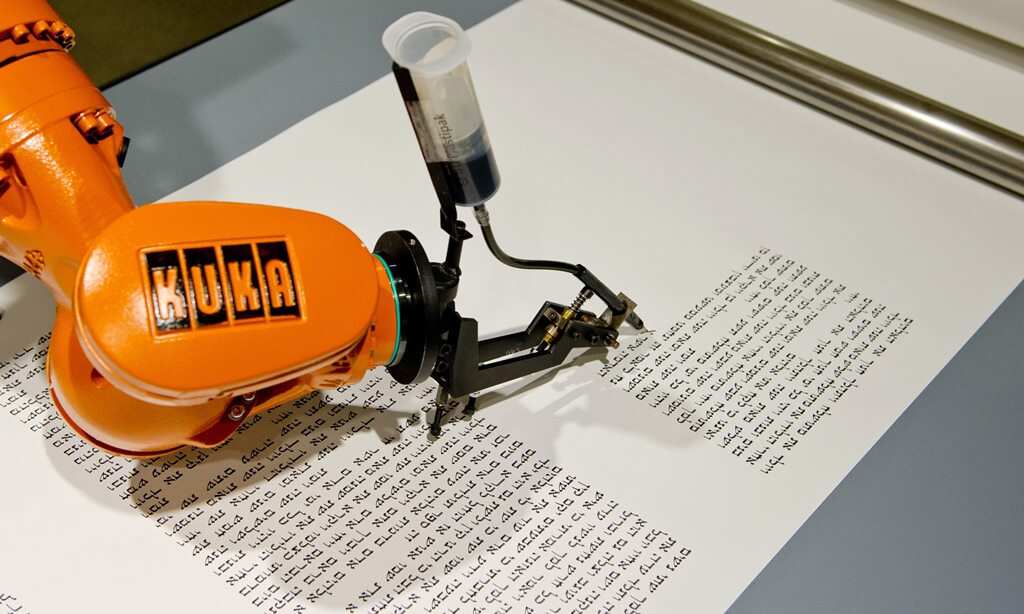 A robot writes a Torah scroll at the Jewish Museum in Berlin, Germany, 10 July 2014. (EPA)