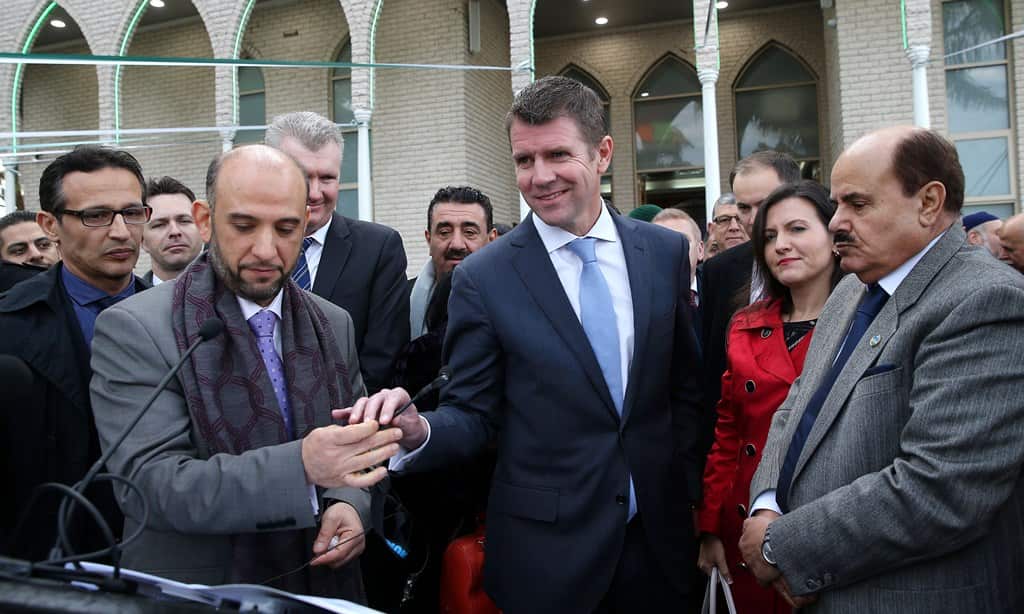 Premier of NSW, Mike Baird (centre) addresses thousands of Muslims surrounding the Mosque in Lakemba to mark the end of the holy month of Ramadan, Sydney, July 28, 2014. (AAP)