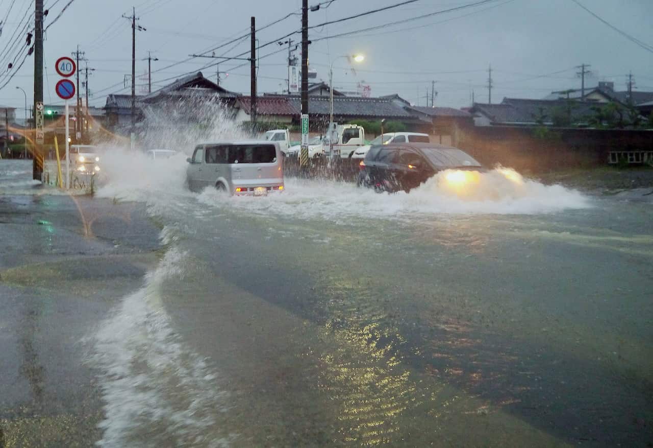 Flooded road in the city of Tsu, Mie prefecture as Typhoon Halong touches down