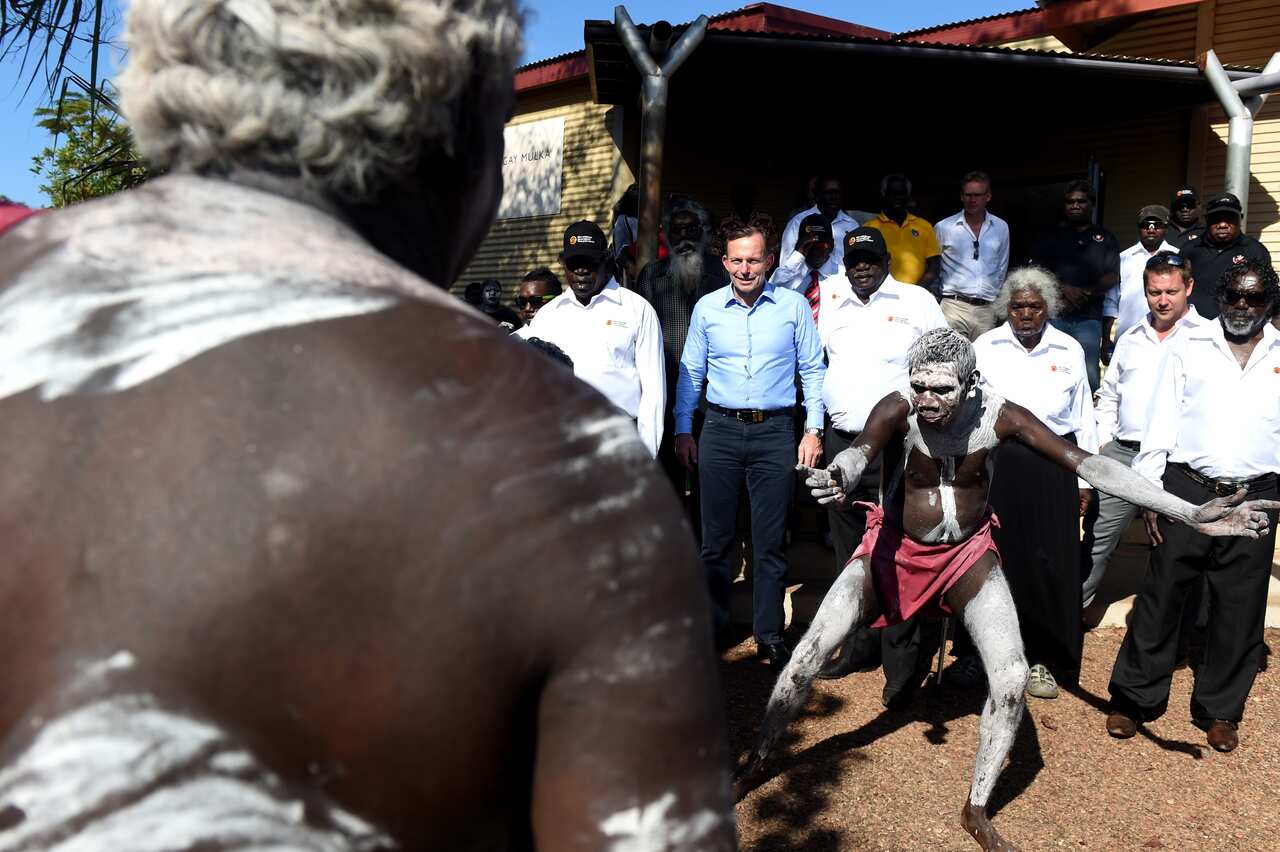 Prime Minister Tony Abbott during a traditional Welcome to Country ceremony on his arrival at Yirrkala on the Gove Peninsula in North East Arnhem Land. (AAP)