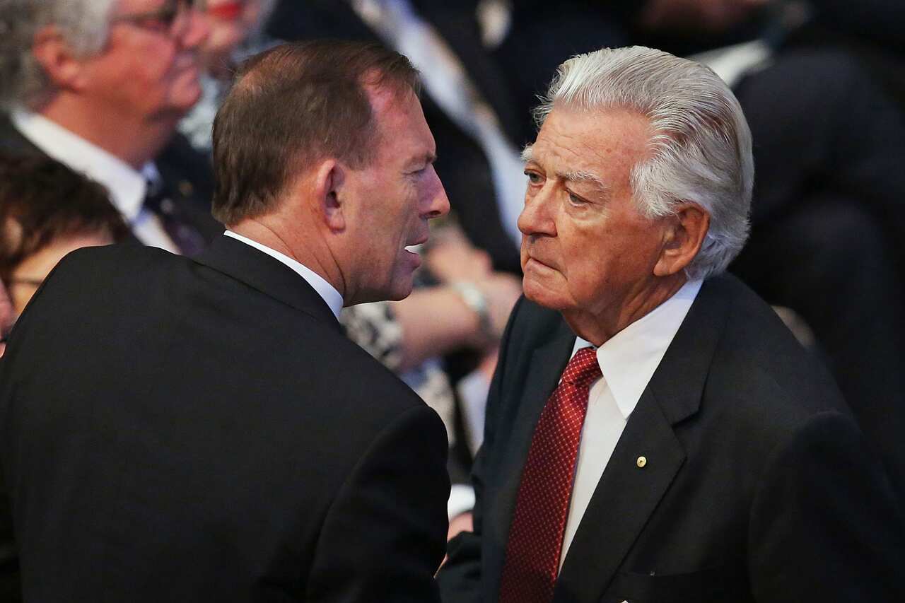 Former Prime Minister Bob Hawke speaks with then Prime Minister Tony Abbott in 2014.