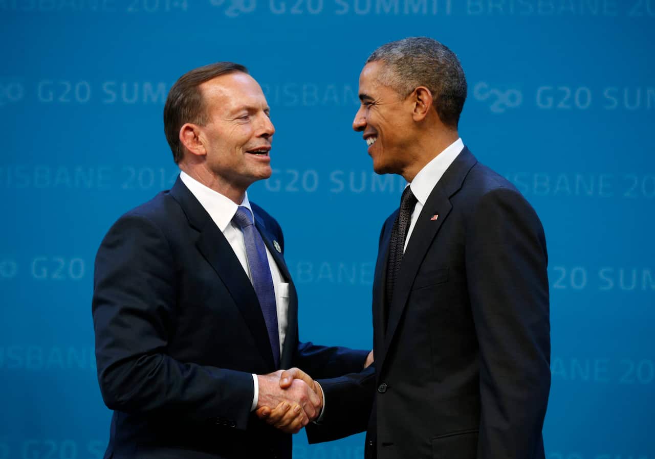 Former President Barack Obama is welcomed by then Prime Minister Tony Abbott.