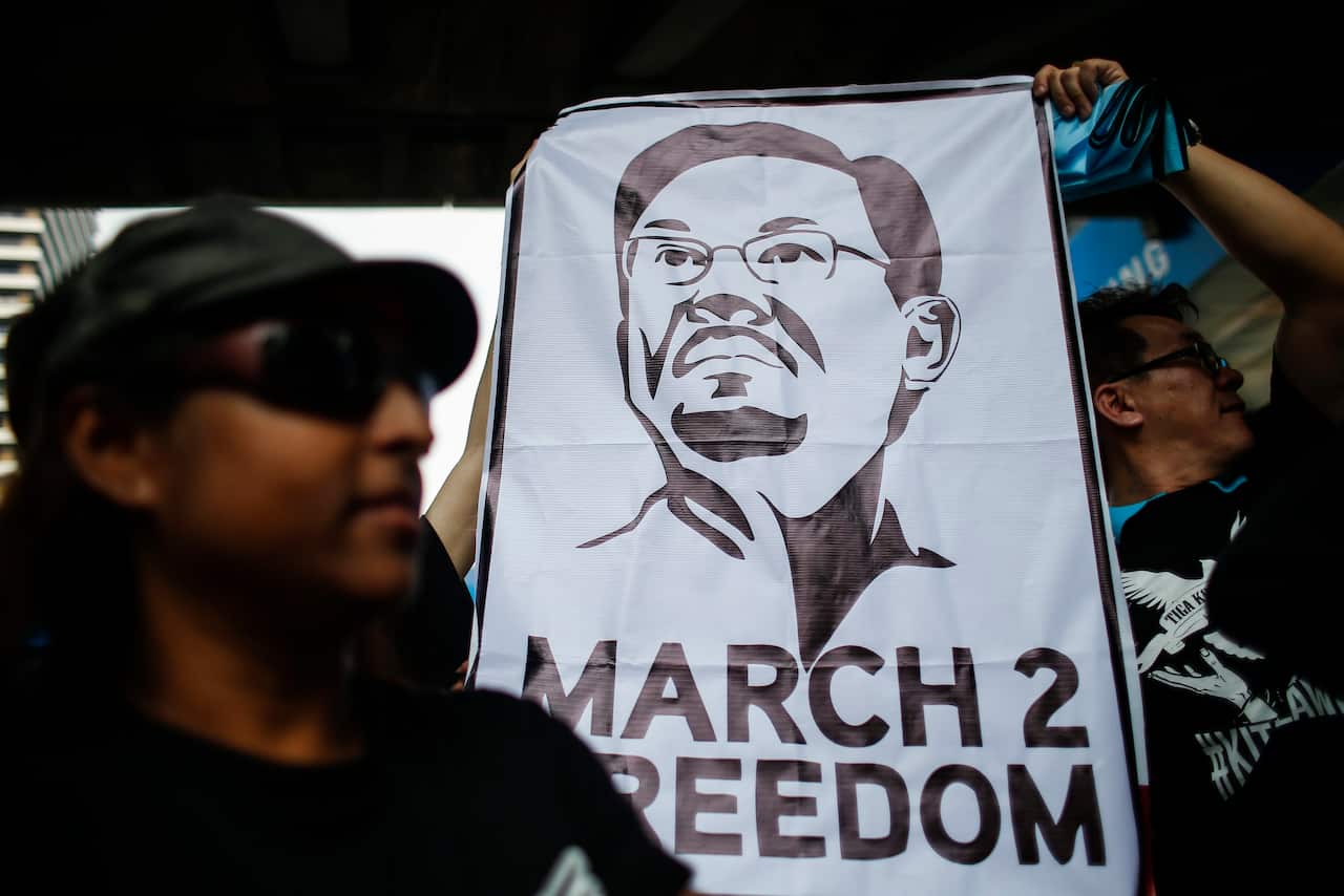 Supporters of Malaysian opposition leader Anwar Ibrahim hold a 'March To Freedom' placard during a rally in Kuala Lumpur, Malaysia, March 2015.