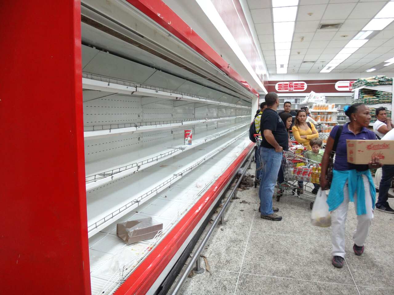 Empty shelves at a supermarket in Caracas.