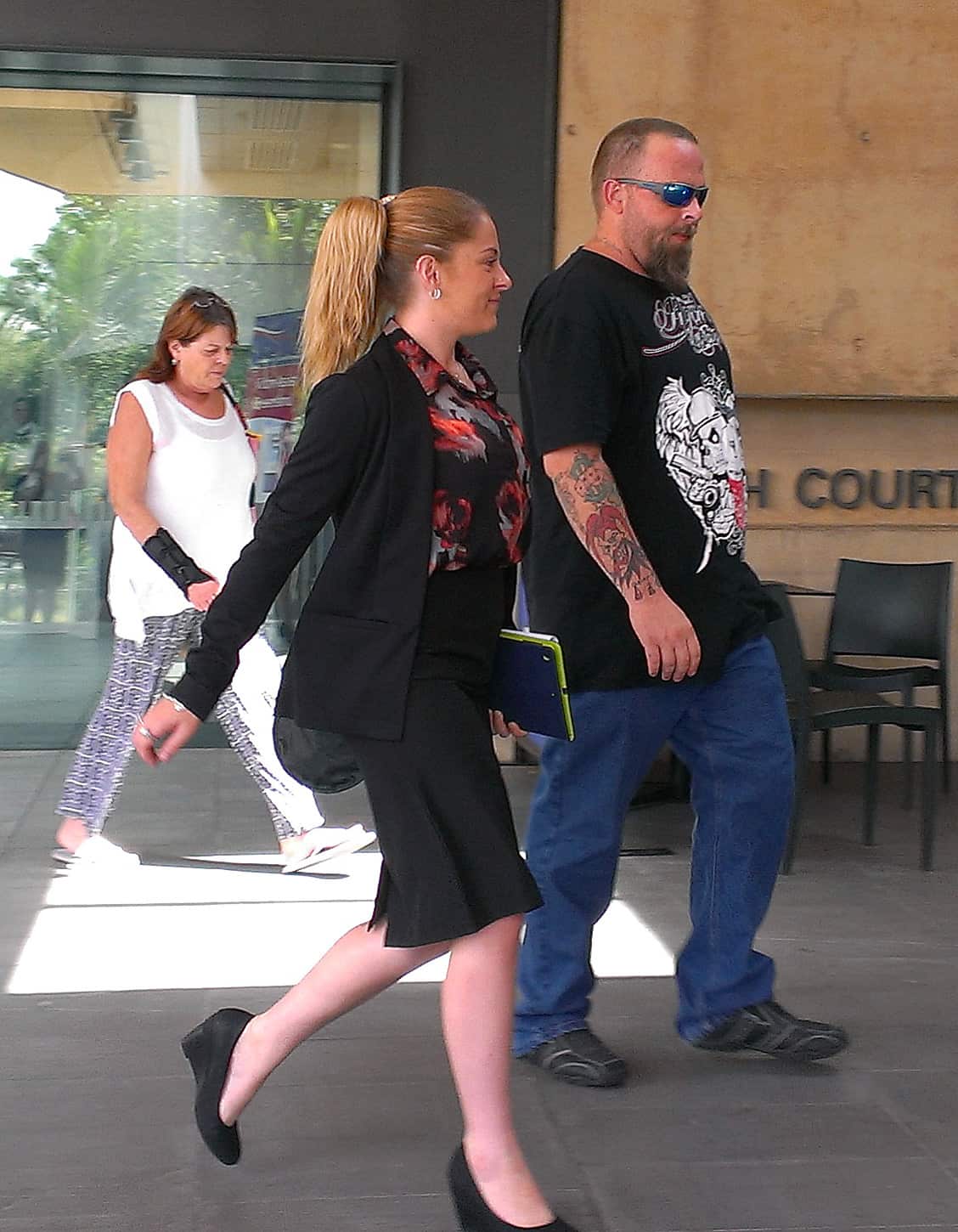 Accused racist ranter Jay-Leighsa Bauman (left), leaves the Ipswich Magistrates Court in Queensland, Wednesday, March 11, 2015 (AAP)