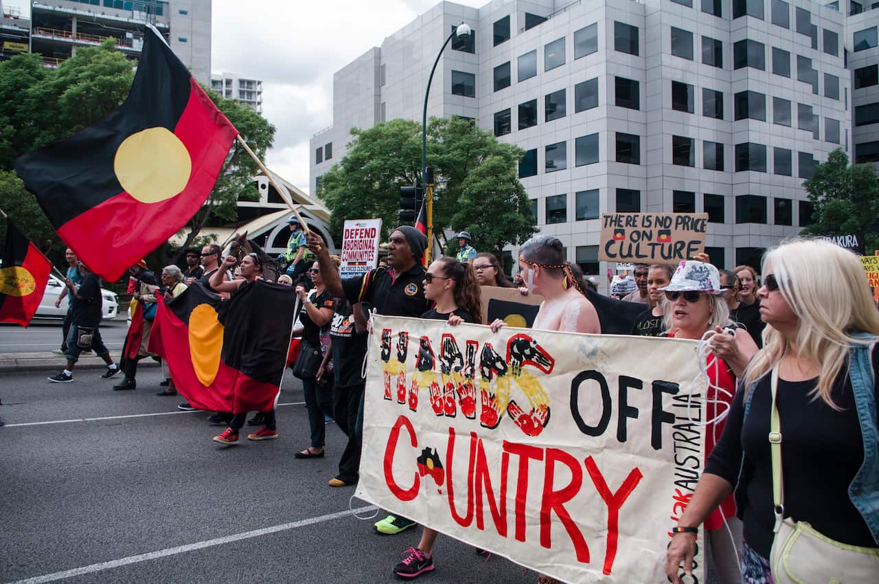 Hundreds of protesters march to parliament in the Perth CBD to rally against the state government's planned closure of more than 100 remote communities. (AAP)