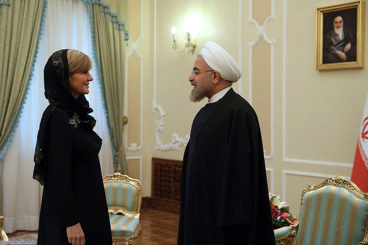 Iran's President Hassan Rouhani, right, greets Australian Foreign Minister Julie Bishop in Tehran, Iran.