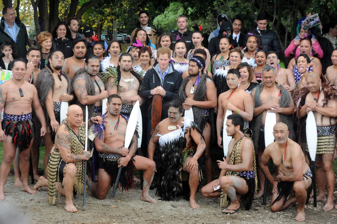 FILE: Prince Harry poses with the Maori waka (canoe) crew before rowing down the Whanganui River, in Wanganui, New Zealand.