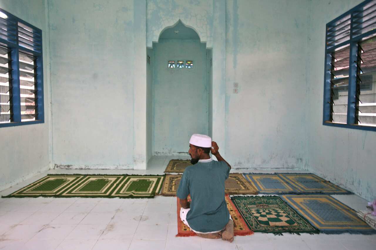 An ethnic Rohingya man prays at a mosque near his temporary shelter in Langsa, Aceh province, Indonesia. (AP)