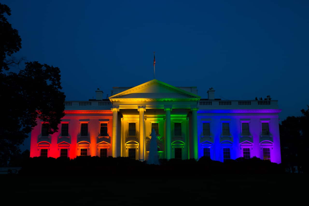  The White House is illuminated in celebration after the Supreme Court ruled that the Constitution guarantees a right to same-sex marriage, on Friday, June 26, 2015, in Washington. (AP Photo/Evan Vucci)