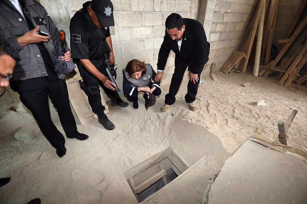 Authorities inspect the exit of the tunnel they claim was used by drug lord Joaquin "El Chapo" Guzman to break out of the Altiplano maximum security prison in Almoloya, west of Mexico City